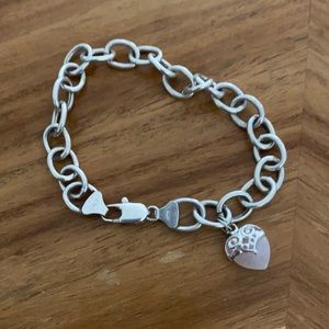Chunky silver bracelet with quartz heart charm